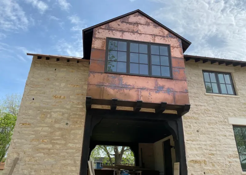 Copper metal panel facade on a stone building for Skylight Installation in Skippack